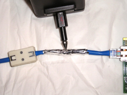 ESD current injection using aluminum foil and ferrite on cable