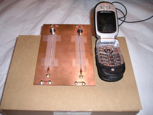 Mobile phone next to test board