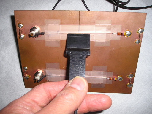 Shielded loop held up to circuit board