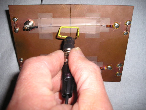 Unshielded wire loop held to circuit board