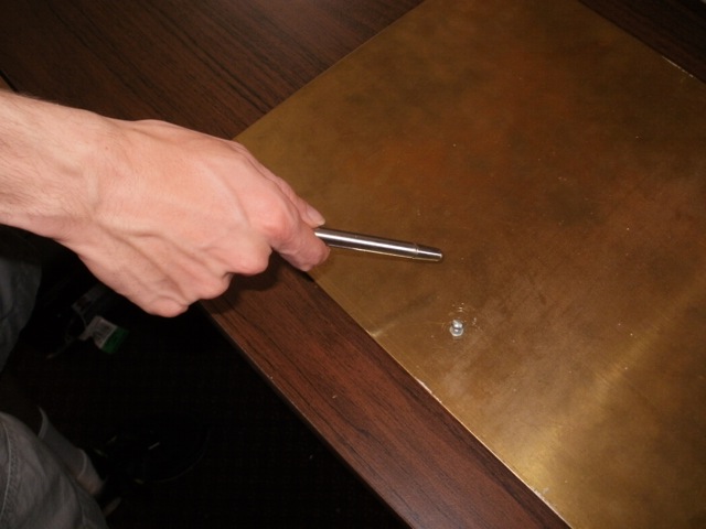 Discharge from a collapsed metal pointer